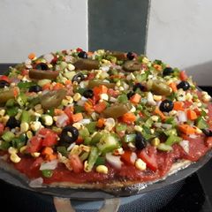A picture of Thin Crust Fire Pizza Loaded (handmade pizza base).
