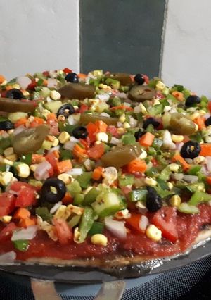 A picture of Thin Crust Fire Pizza Loaded (handmade pizza base).