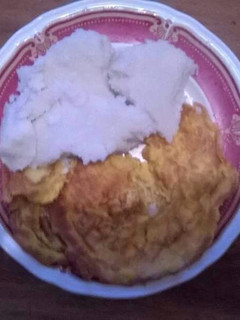 A picture of Fried eggs with ugali.