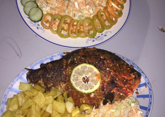 Grilled fish with french fries and coleslaw