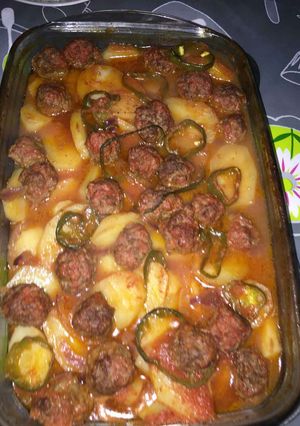 A picture of Baked Potato and Tomato Casserole with Kofta.