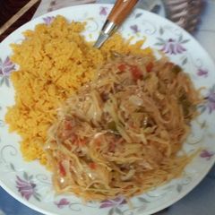 Tumeric rice served with cabbage A picture of Tumeric rice served with cabbage.