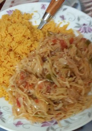A picture of Tumeric rice served with cabbage.