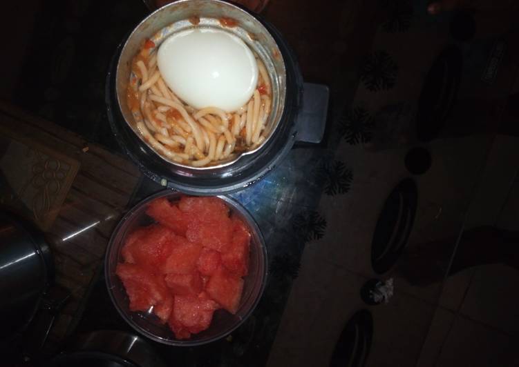Jollof Spaghetti and egg with watermelon