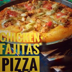 A picture of Chicken fajitas pizza.