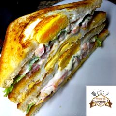 A picture of Egg in a hole sandwich.