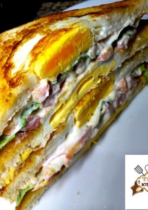 A picture of Egg in a hole sandwich.