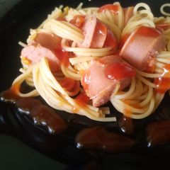 A picture of Beef smokie Spaghetti with sauce.