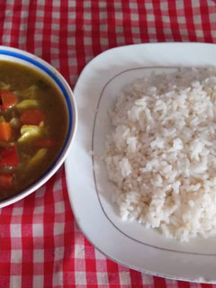 A picture of Rice and chicken sauce.