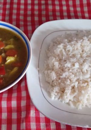 A picture of Rice and chicken sauce.
