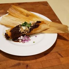 A picture of Smokey Red Chile Shredded Beef Tamales.