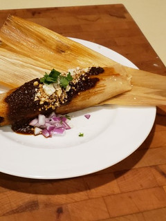 A picture of Smokey Red Chile Shredded Beef Tamales.