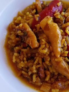 Una foto de Arroz meloso con bacalao y piquillos confitados