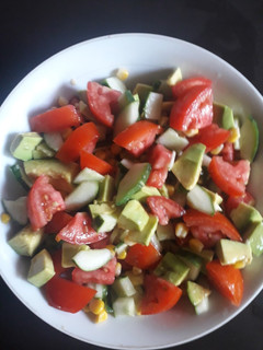 A picture of Tomato, Cucumber, Avocado and Sweetcorn salad.