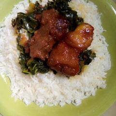A picture of Wite Rice And vegetable soup.