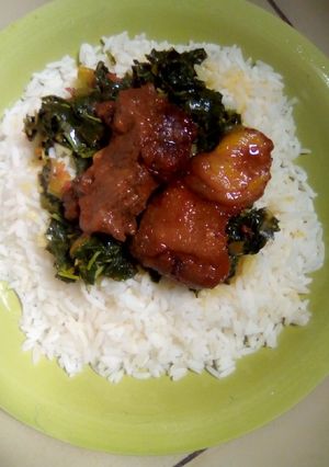 A picture of Wite Rice And vegetable soup.