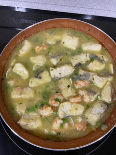 Una foto de Merluza con salsa verde