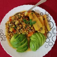 A picture of Chillie peas-matoke served with guacamole.