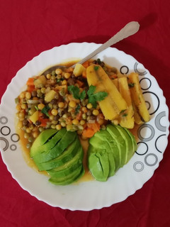 A picture of Chillie peas-matoke served with guacamole.