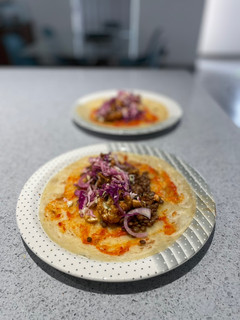 A picture of Lentil, cauliflower and pickled cabbage rotis.