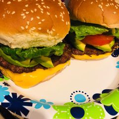 A picture of Homemade cheeseburgers with a Latin twist.