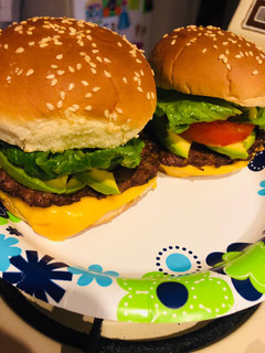 A picture of Homemade cheeseburgers with a Latin twist.