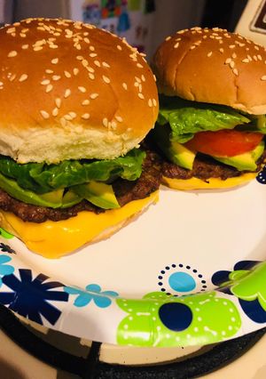 A picture of Homemade cheeseburgers with a Latin twist.