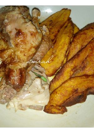 A picture of Roasted chicken breast with fried plantain.