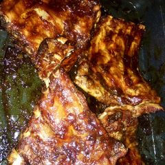 A picture of Sweet sticky roasted pork ribs.