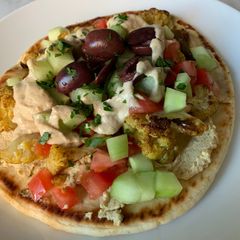 A picture of Cauliflower Shawarma with Tahini Sauce.