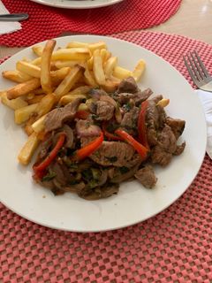 Una foto de Lomo Saltado