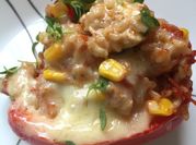 A picture of chicken stuffed bell peppers