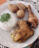 Pollo al horno con papitas, especias y mantequilla