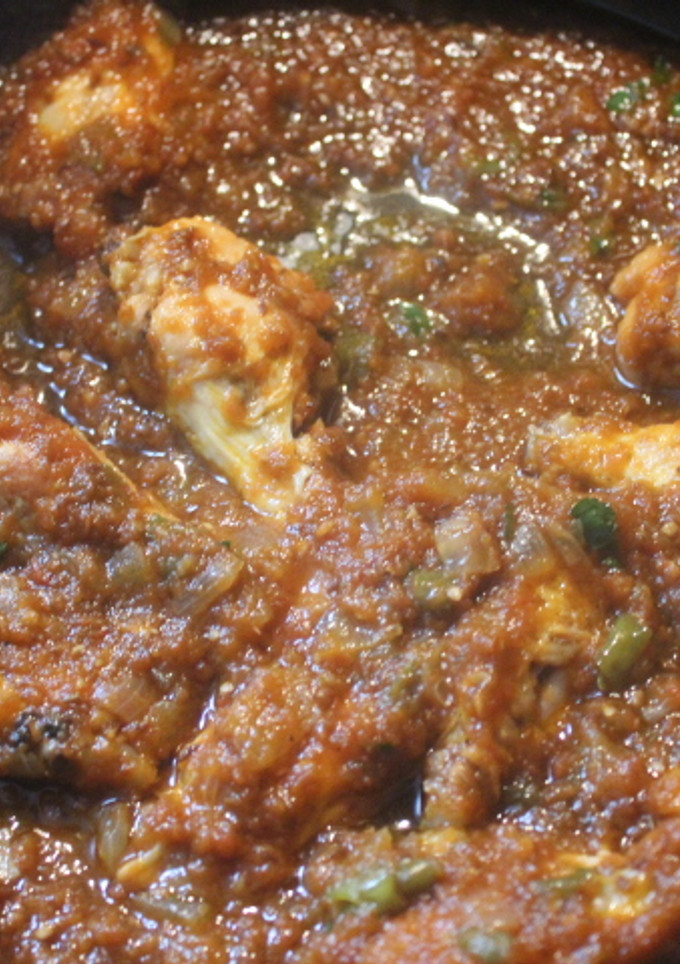 Una foto de Alitas en salsa de tomate kumato