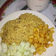 A picture of Indomie with fried Irish potato and cucumber #teamabuja.