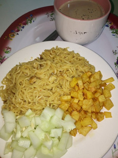 A picture of Indomie with fried Irish potato and cucumber #teamabuja.