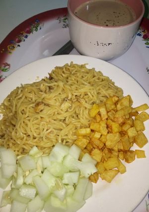 A picture of Indomie with fried Irish potato and cucumber #teamabuja.