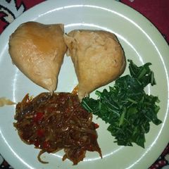 A picture of Moi moi, steamed spinach and onion sauce.
