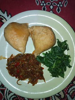 A picture of Moi moi, steamed spinach and onion sauce.