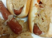 A picture of sauerkraut sausage and hotdogs