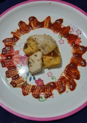 A picture of Dhokla,masala dhokla,double layer dhokla.