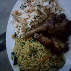 A picture of Butter Fried rice and coleslaw.