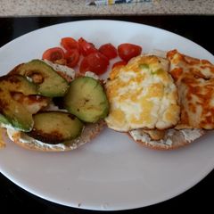 A picture of My Grilled Halloumi + Avocado Bagel with a hint of Chilli 🥰.