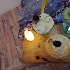 A picture of Basic fruit custard with pista icream.