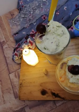A picture of Basic fruit custard with pista icream.