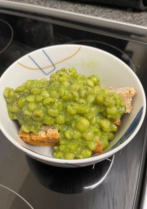 A picture of Pork Pie with Mushy Peas.