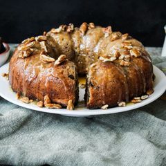 A picture of Spiced Pecan nut and Date pudding in a bundt.