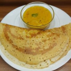 A picture of Maize Millet Dosa with Sambar.