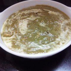 A picture of Cottage cheese scrambled/cubed in creamy garlicky spinach gravy.