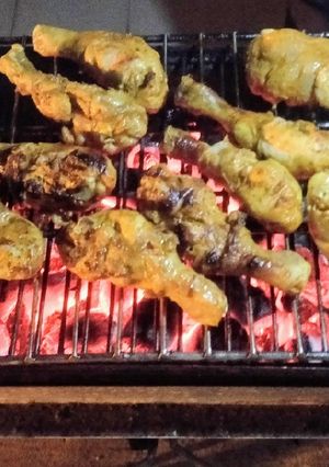 A picture of Chicken paprika drums Skewered red hot Shrimps and grilled sausages.